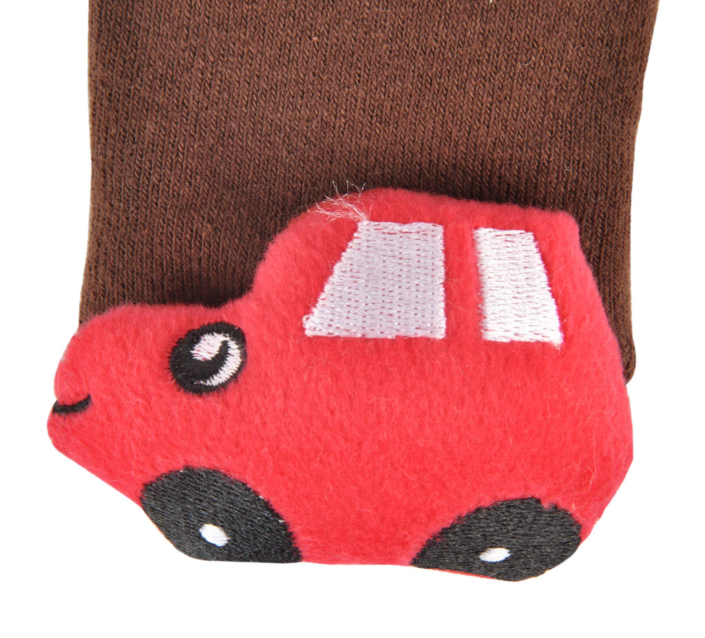 Close-up of the red stuffed toy car on the brown toddler socks.