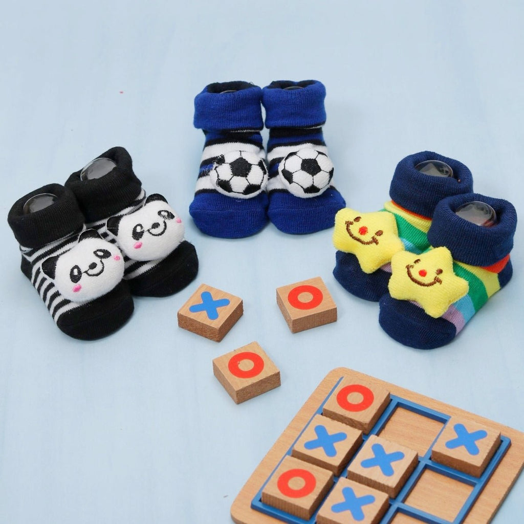 Baby boy's playful panda and football socks set with a fun design.