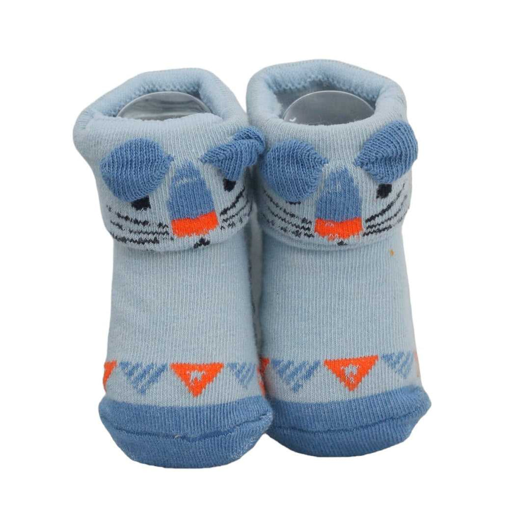 Light blue baby socks with playful shark print and anti-skid bumps by Yellow Bee.