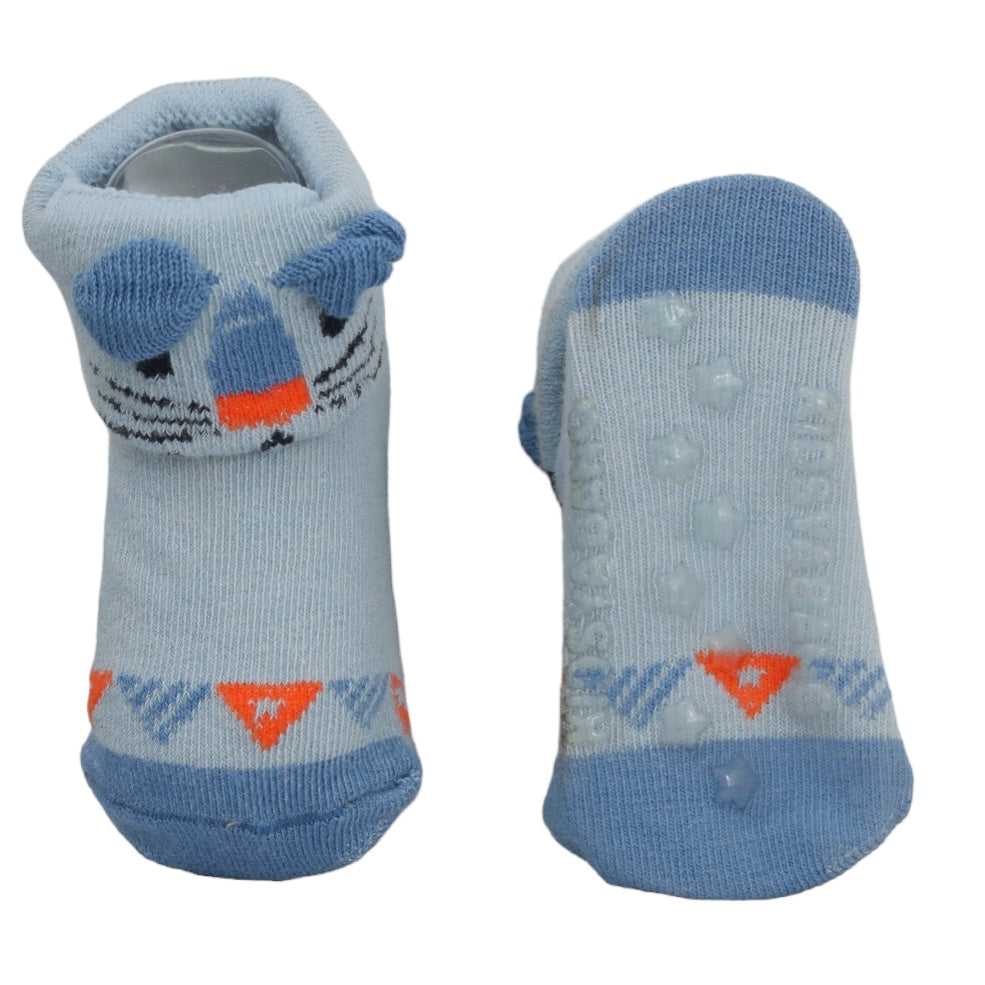 Detailed view of Yellow Bee's light blue shark-themed anti-skid socks for babies.