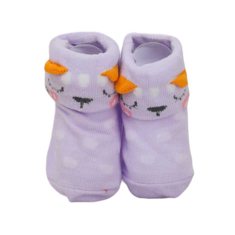 A pair of Yellow Bee's purple animal-themed socks for infants, designed with a soft grip and cheerful face