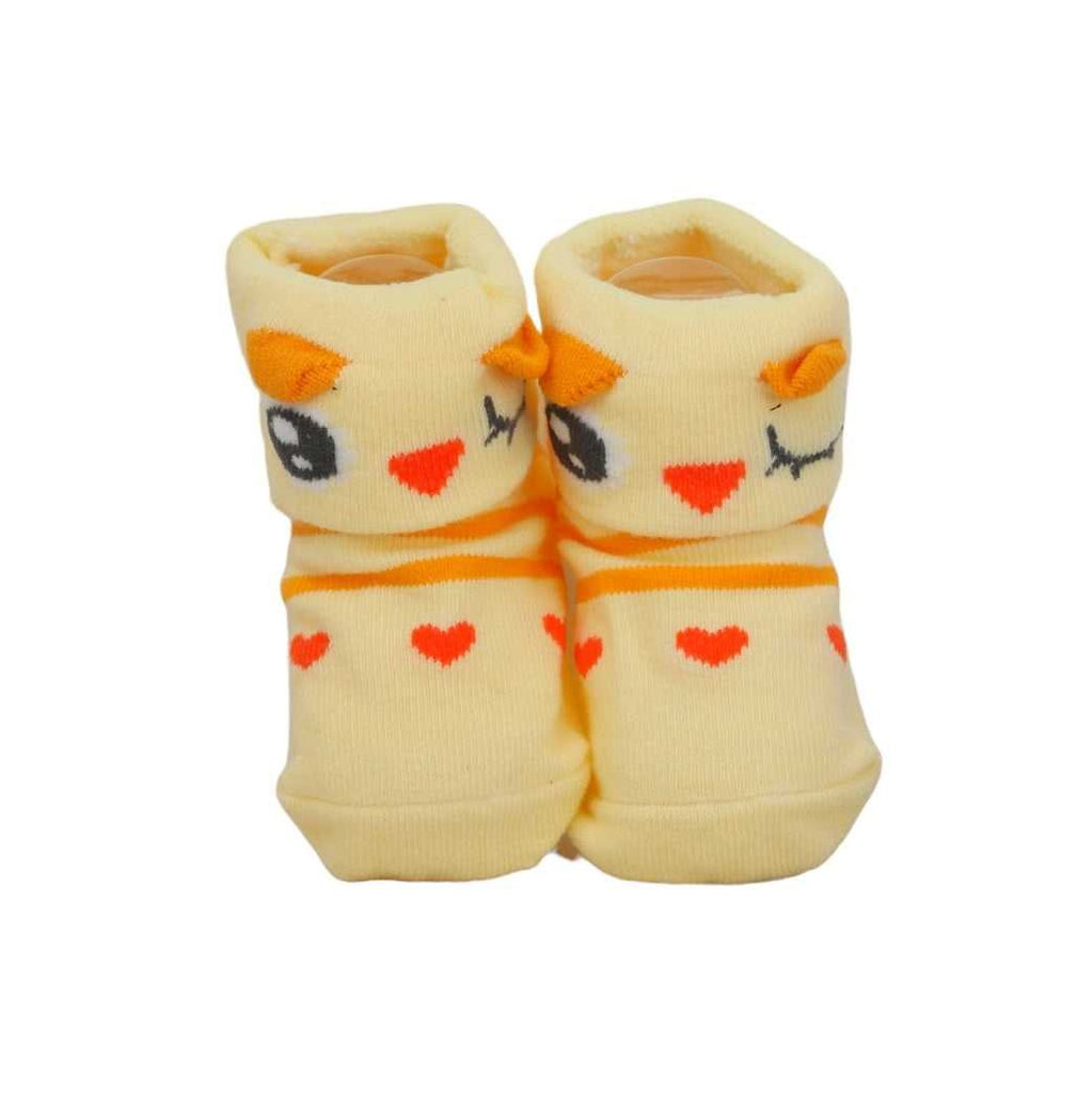 Yellow Bee's yellow animal-themed anti-skid socks for baby girls, standing upright to show the full design