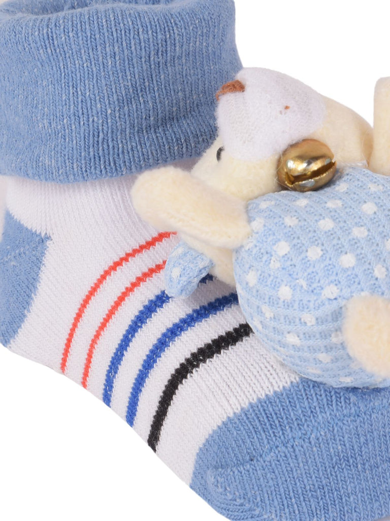 Close-up of baby's bear-stuffed toy sock with non-slip grip
