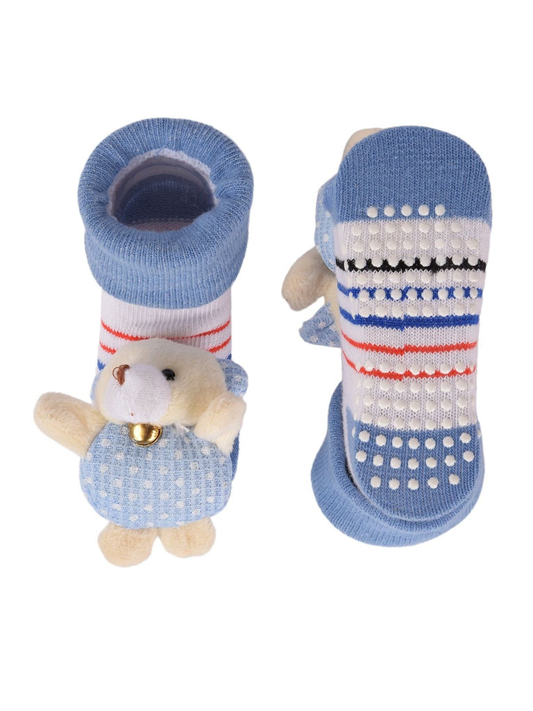 Pair of baby's bear-stuffed toy socks with blue tops and striped pattern