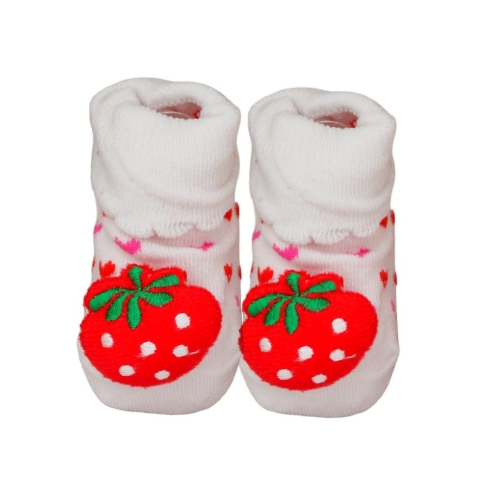 Close-up of white and pink strawberry baby socks.