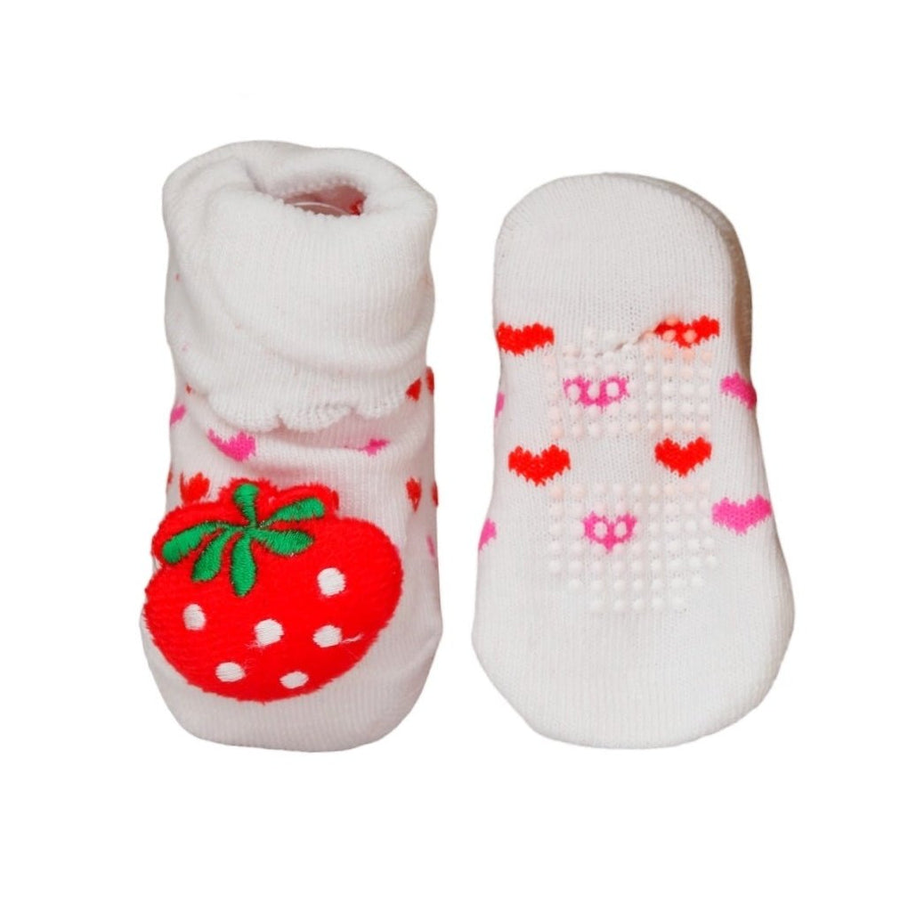 Pair of white baby socks with pink flower and strawberry patterns.