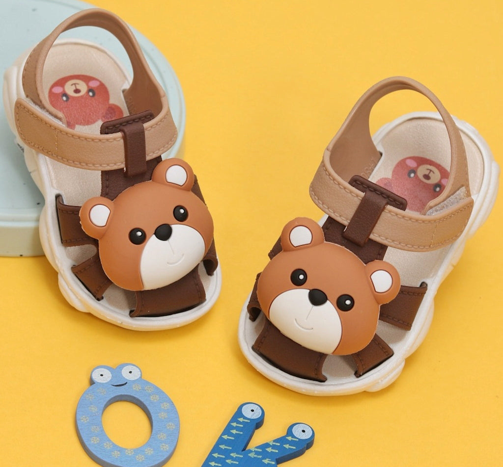 Adorable brown bear sandals for toddlers with a cute bear face and secure straps
