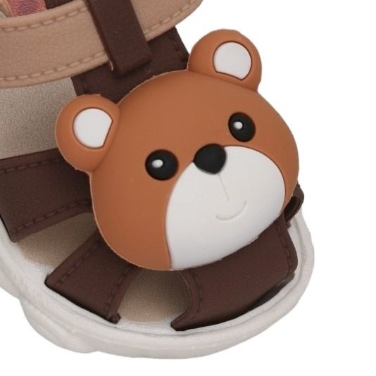 Close-up of the charming bear face on toddler sandals for a cute style statement