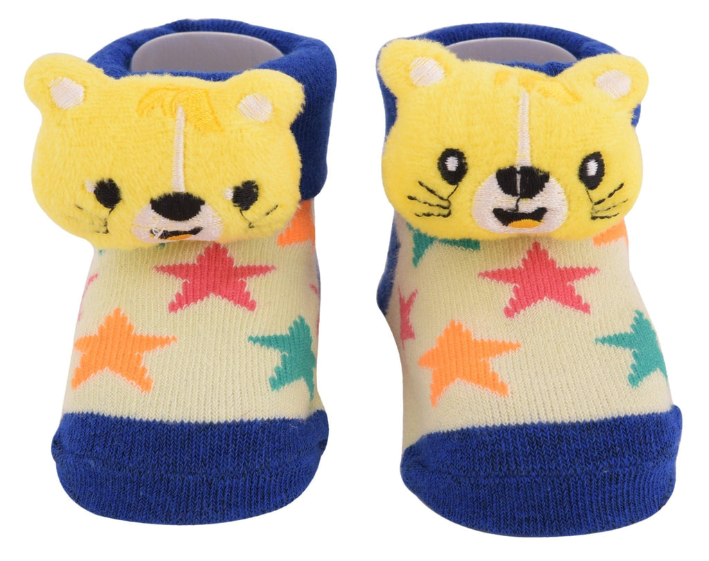 Front view of Infant's yellow bear plush toy socks with colorful star patterns