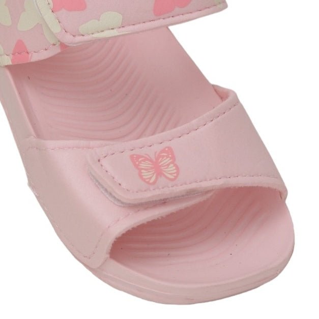 Close-up of the delicate butterfly emblem on pink toddler sandals