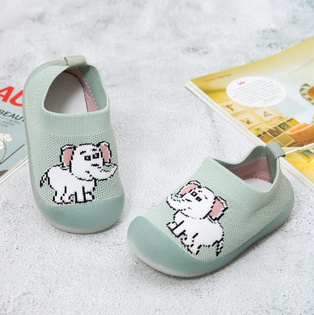 Child's feet in Green Elephant Sock Shoes by Yellow Bee