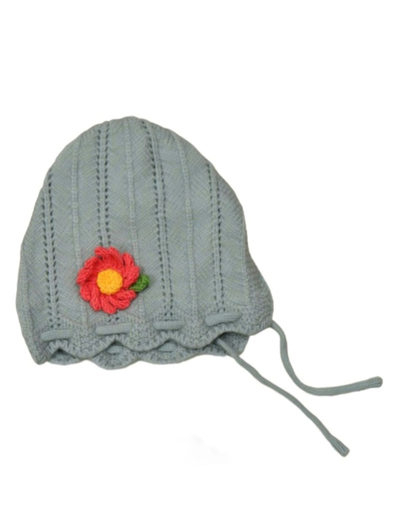 Flat lay of girl's grey knit beanie and muffler set with flower detail
