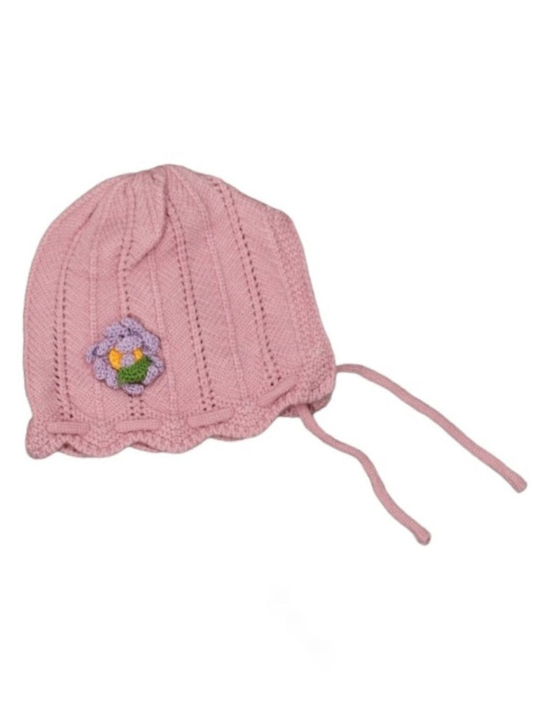 Top view of a pink knitted beanie with a floral accent for toddlers.