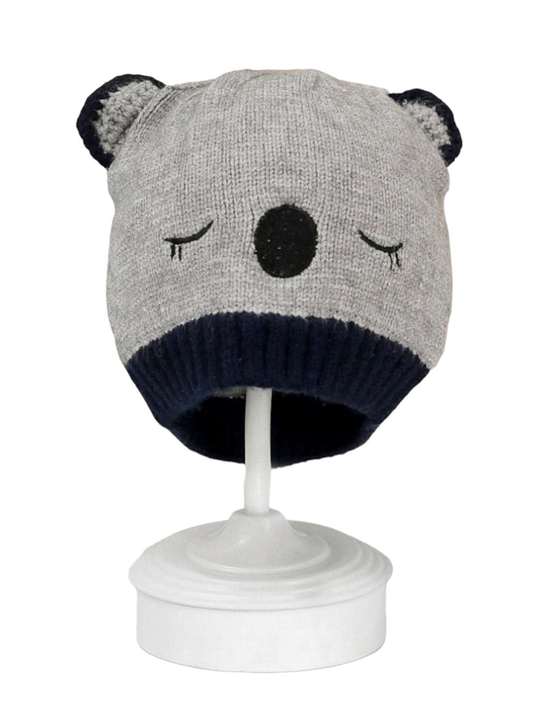 Front view of white bear-themed knitted beanie for boys.