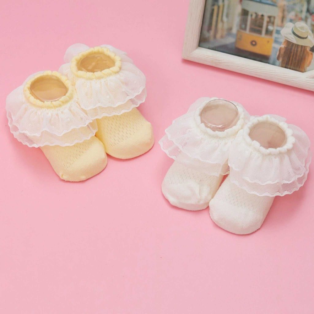 Yellow and White Baby Girl Lace Frill Socks on Pink Background