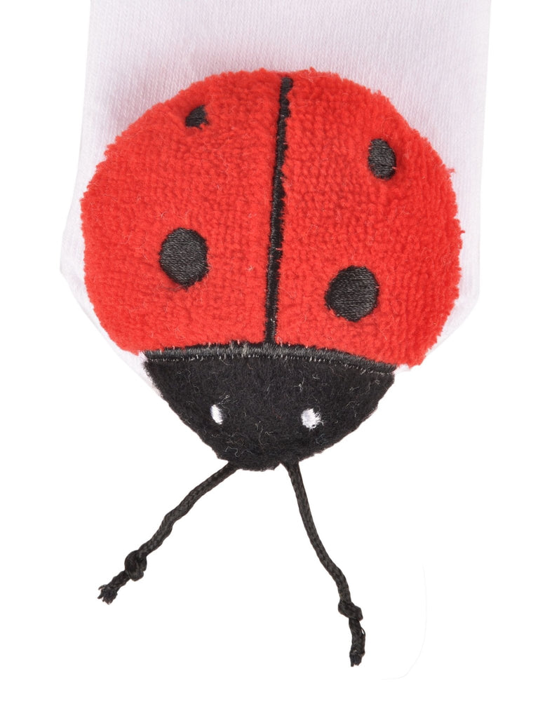 Close-up of toddler's ladybug toy socks with detailed stitching and design
