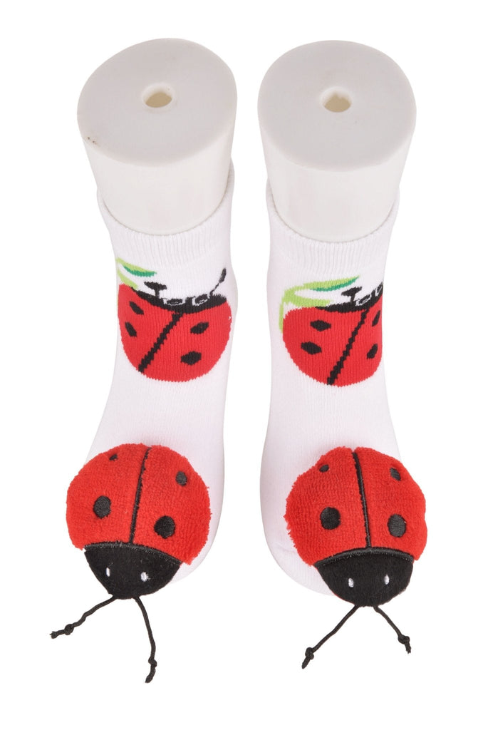 Pair of white ladybug toddler socks with non-slip bottom