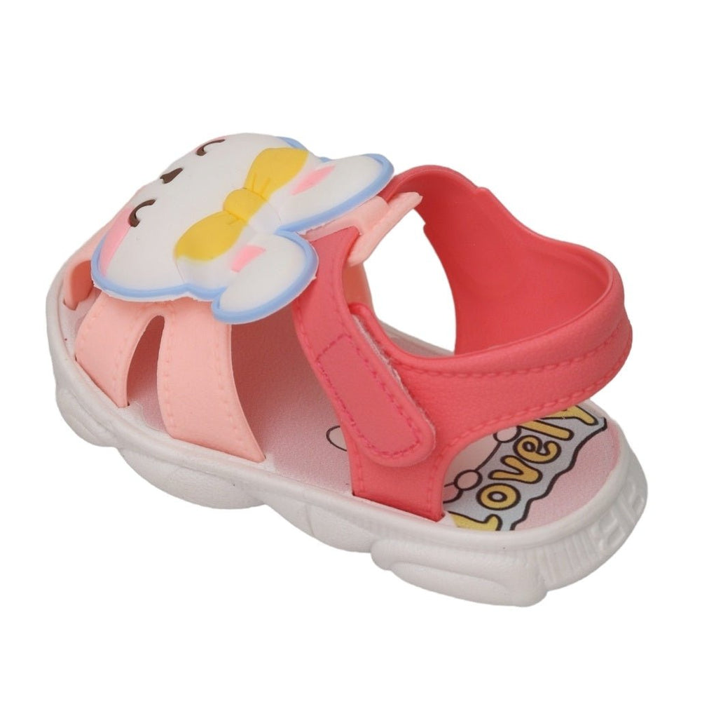 Top view of the playful bunny applique sandals with peach accents and secure strap design.