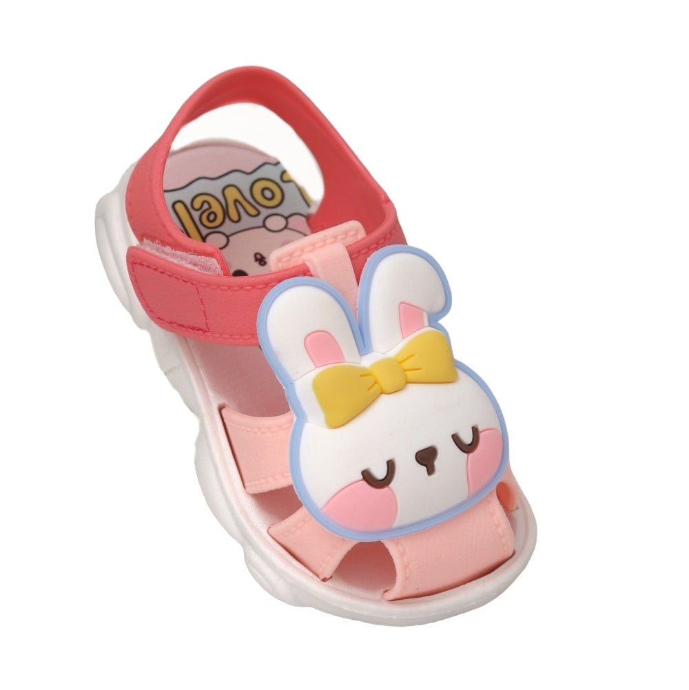 Close-up of peach bunny applique sandals highlighting the adorable facial features and bow.