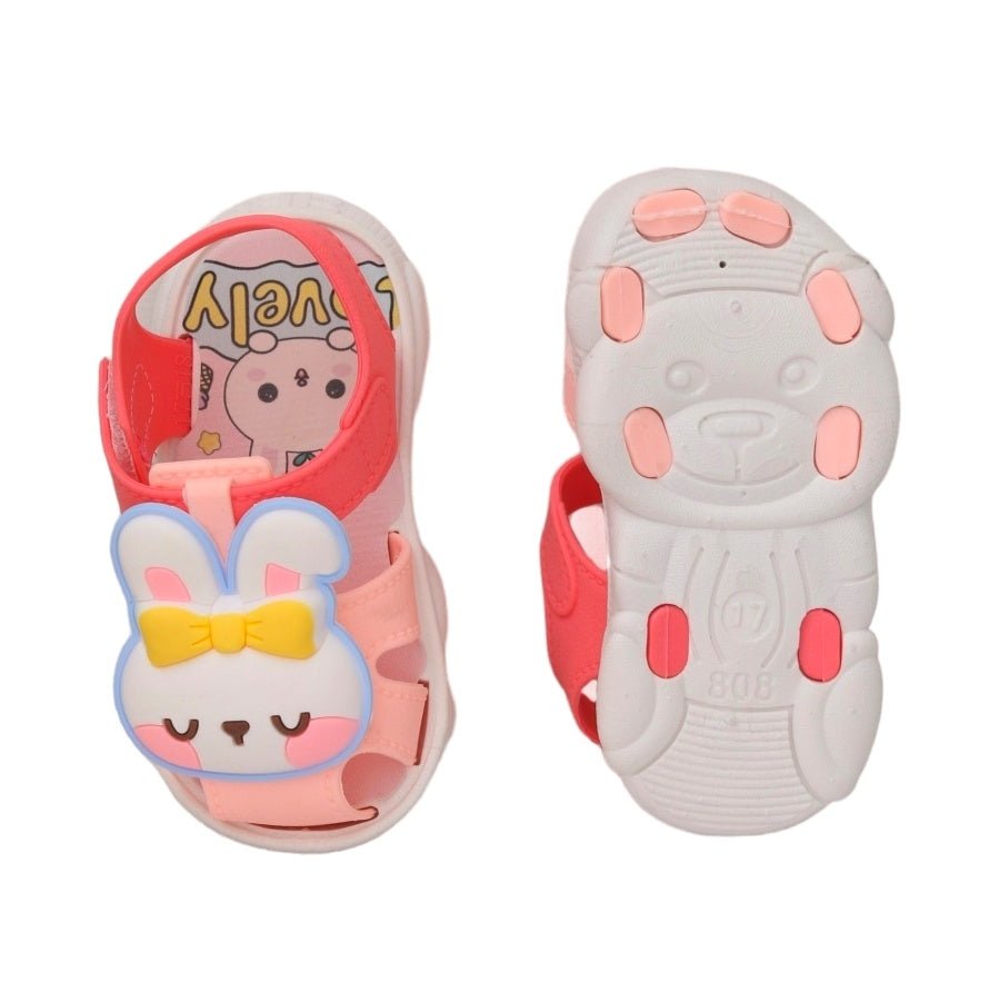 Bottom view of the peach bunny sandals showing the non-slip pattern for safe playtimes.