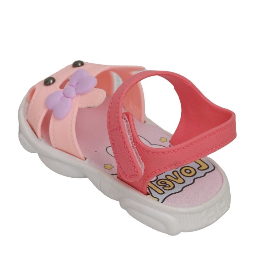 Side angle of a toddler's peach bunny sandal highlighting the supportive strap and comfortable sole.