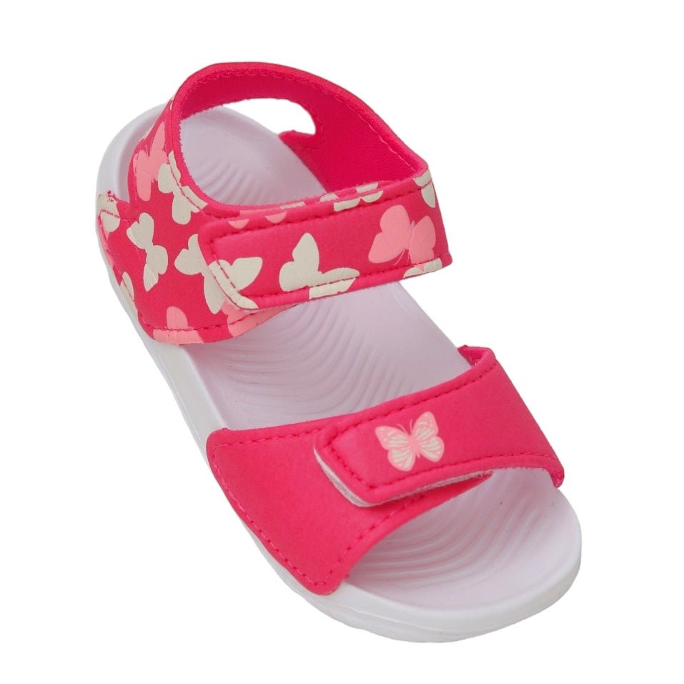 Top angle of toddler's pink sandals adorned with a butterfly print and secure strap