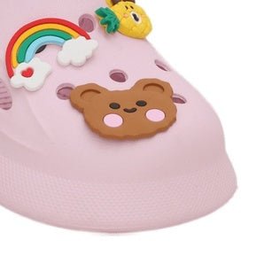 Close-up of the pink clog's front with detailed rainbow and bear designs.