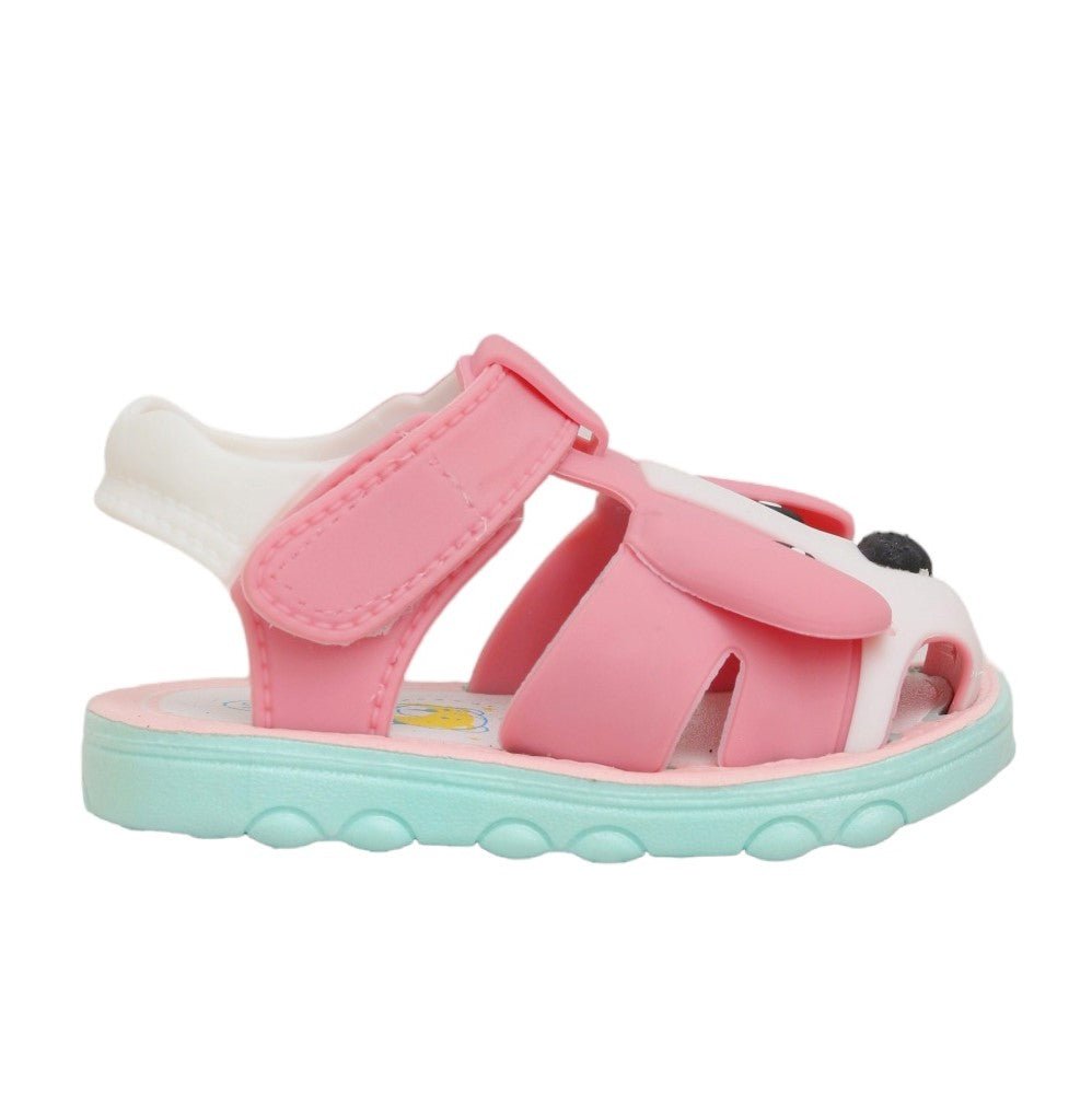 Fun pink toddler sandals with puppy design, three-quarter vLateral side view of pink puppy applique toddler sandals, displaying the secure fit and strap thickness.