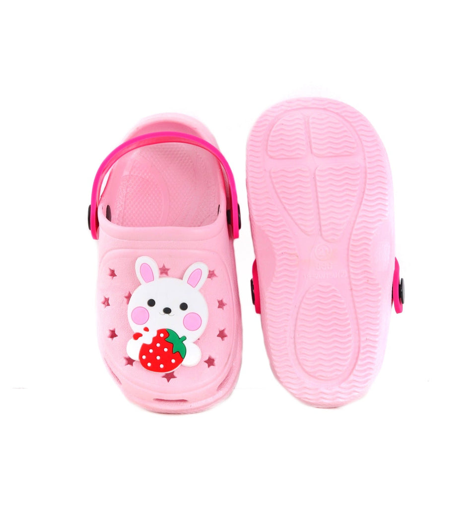 Bottom view of kid's pink clog showing the anti-slip tread and strawberry detail.