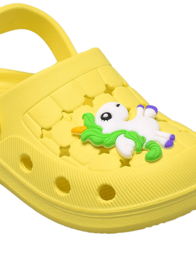 Close-up of the adorable unicorn decoration on yellow kids' clogs, making every step magical.