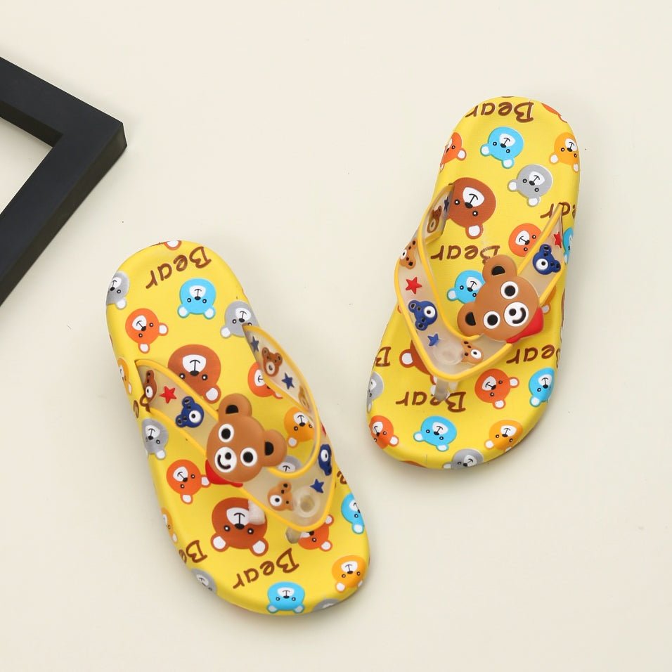 Bright yellow children's flip flops with a fun all-over bear and friends cartoon print