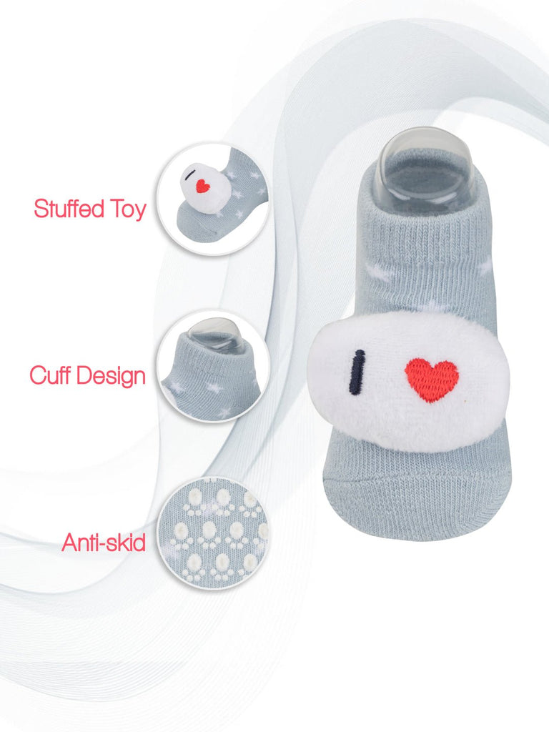 Close-up of blue baby socks with "Stuffed Toy" feature.