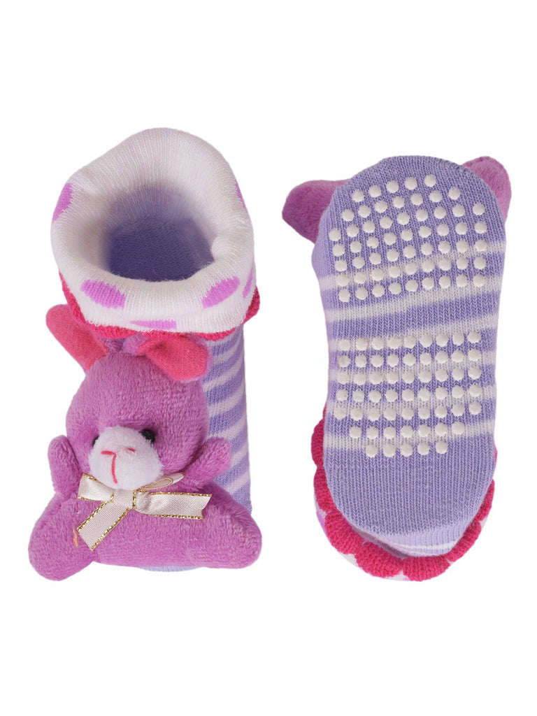 Side view of durable leather socks with 3D flower detail for baby girl