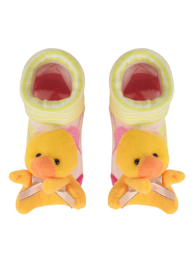Toddler's pink socks with a cute doll face and non-slip grip