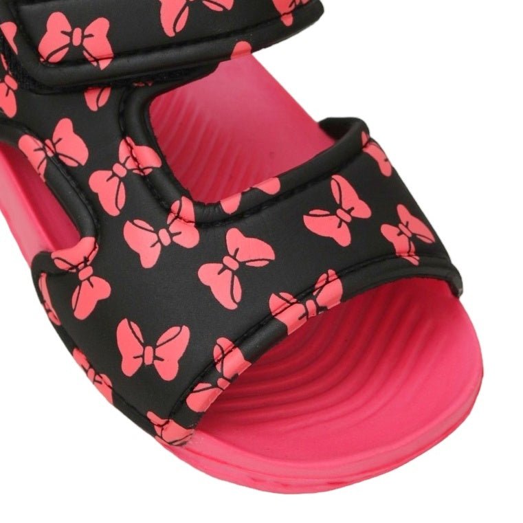 Close-up of playful bow print on kid's black and pink sandals