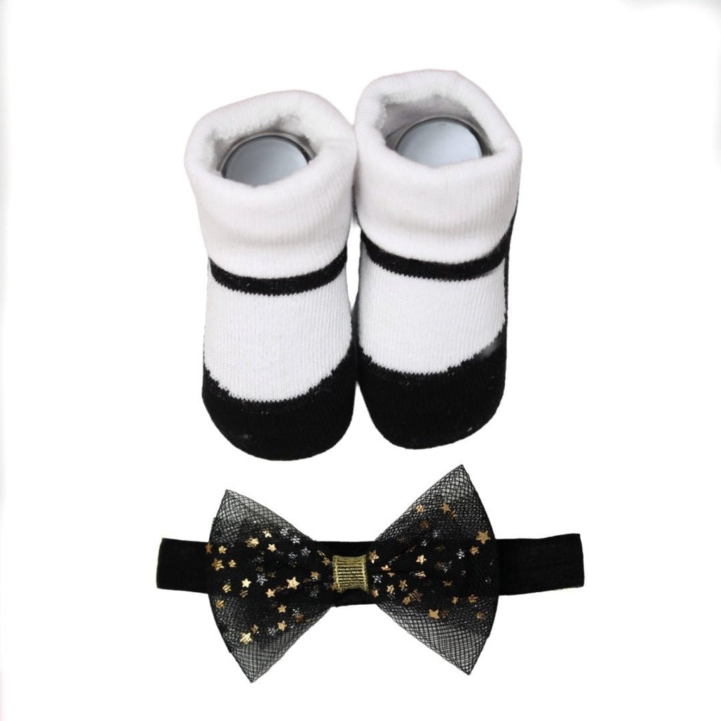 Top view of Yellow Bee's black and white socks and bow headband set.