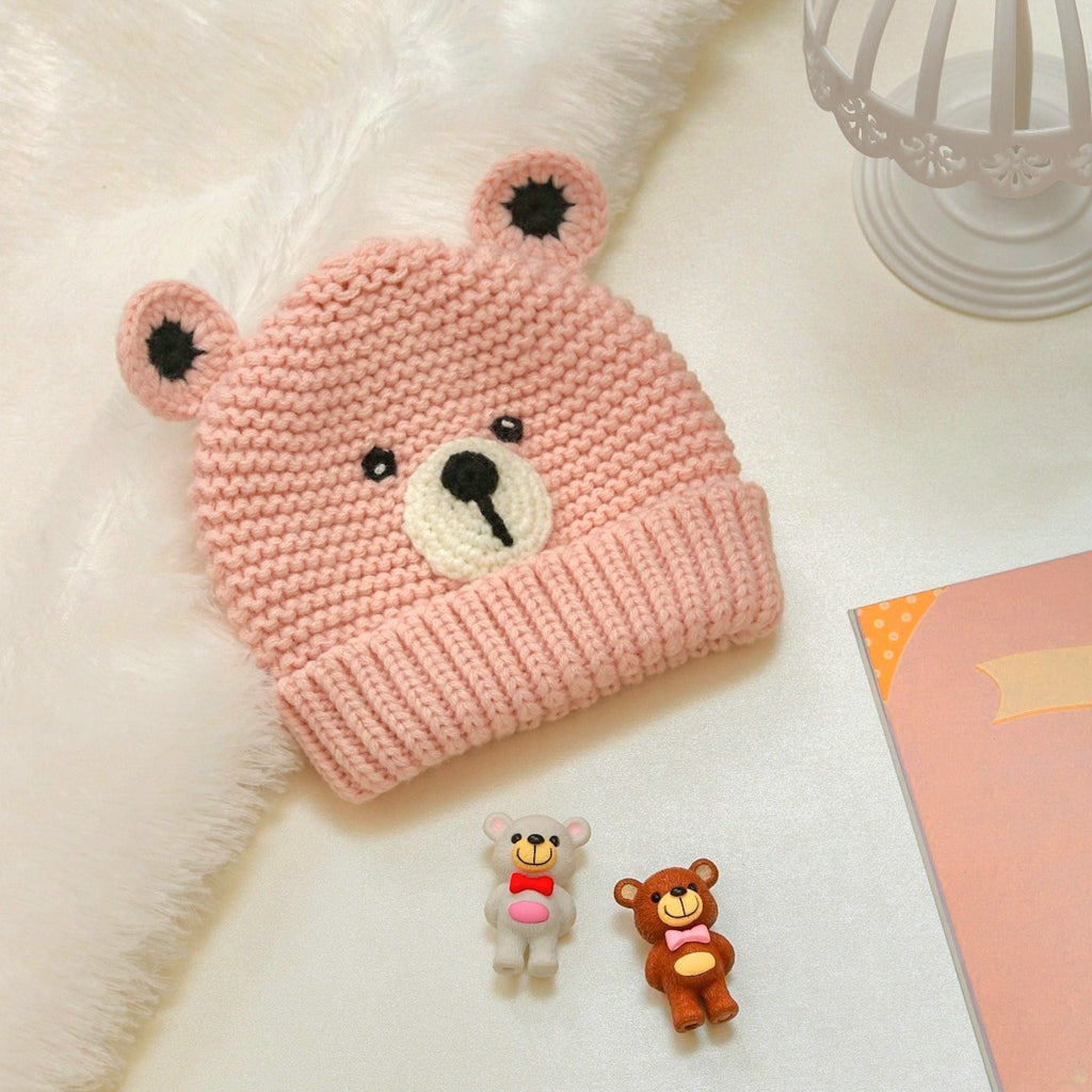 Pink woolen beanie with a cute teddy bear face for girls, perfect for infants 6-12 months old