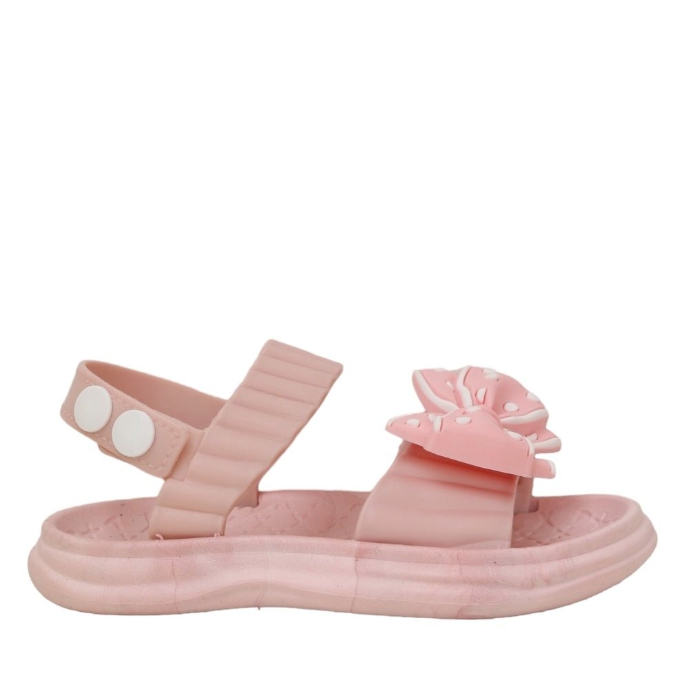 Side view of pink bow detail sandal showcasing its secure strap and comfortable footbed.