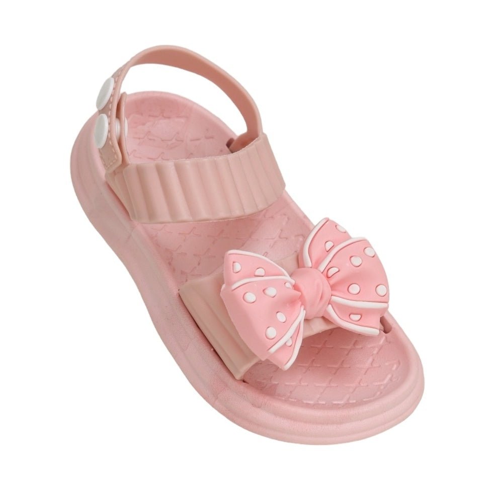 Elegant single pink bow detail sandal highlighting the charming polka dot pattern on the bow.