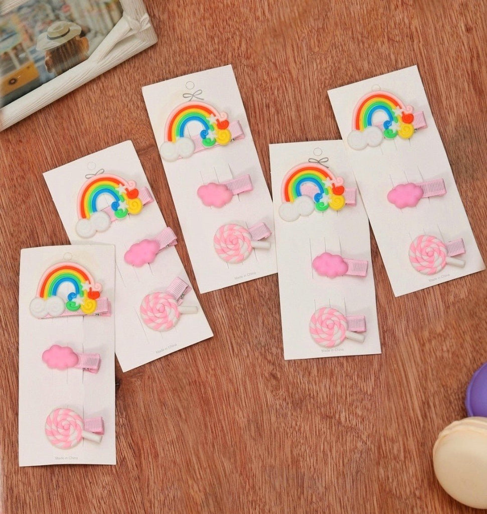 Yellow Bee hair clips pack featuring clouds, rainbows, and candy on a display card