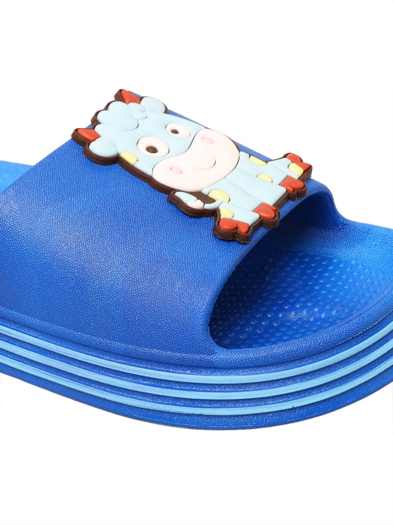 Adorable cow applique on child's deep blue slide sandal close-up
