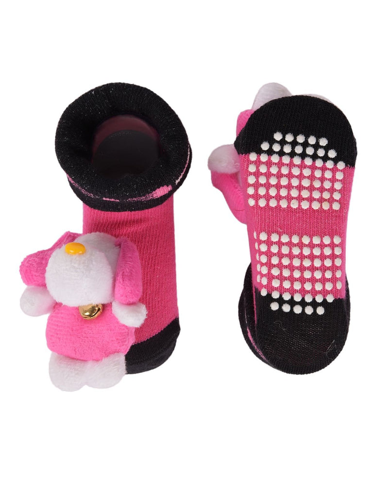 Pair of teddy bear stuffed toy socks with flexible outsole visible.