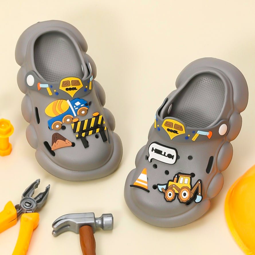 Yellow Bee Grey Clogs for Boys with Colorful Construction Motifs on Display