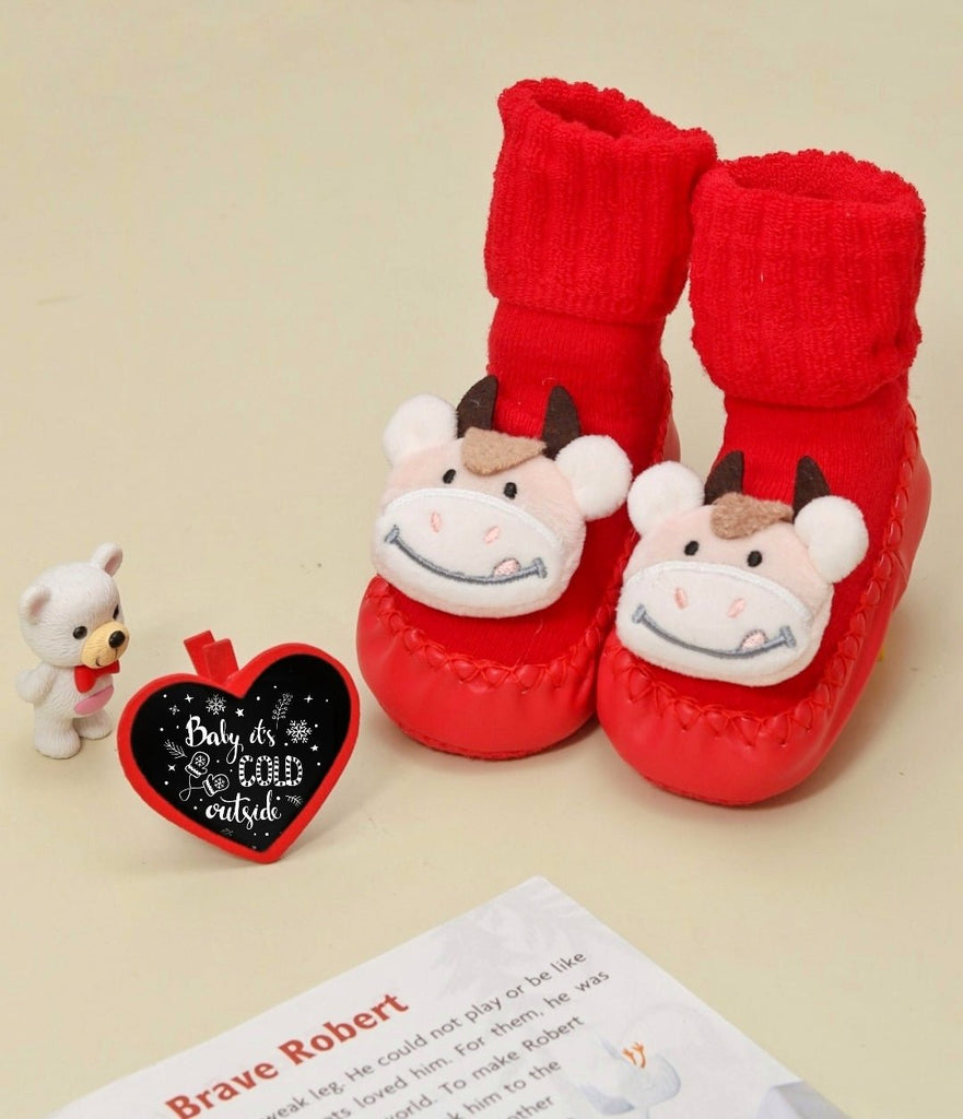 Red cow-themed shoe socks with plush toy detailing for girls by Yellow Bee.