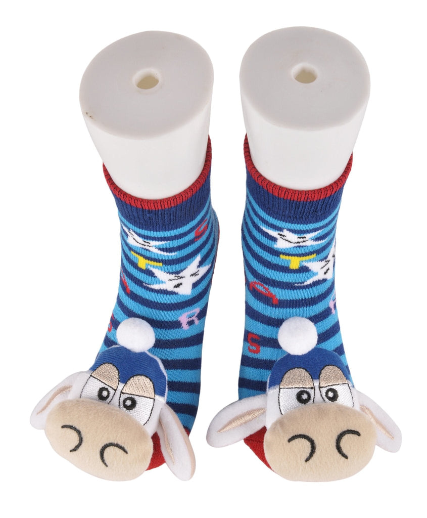 Children's blue striped socks with cow stuffed toy on the toes, standing view.