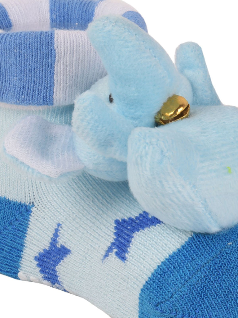 Yellow Bee's baby socks with anti-slip sole and charming blue elephant stuffed toy on the front.