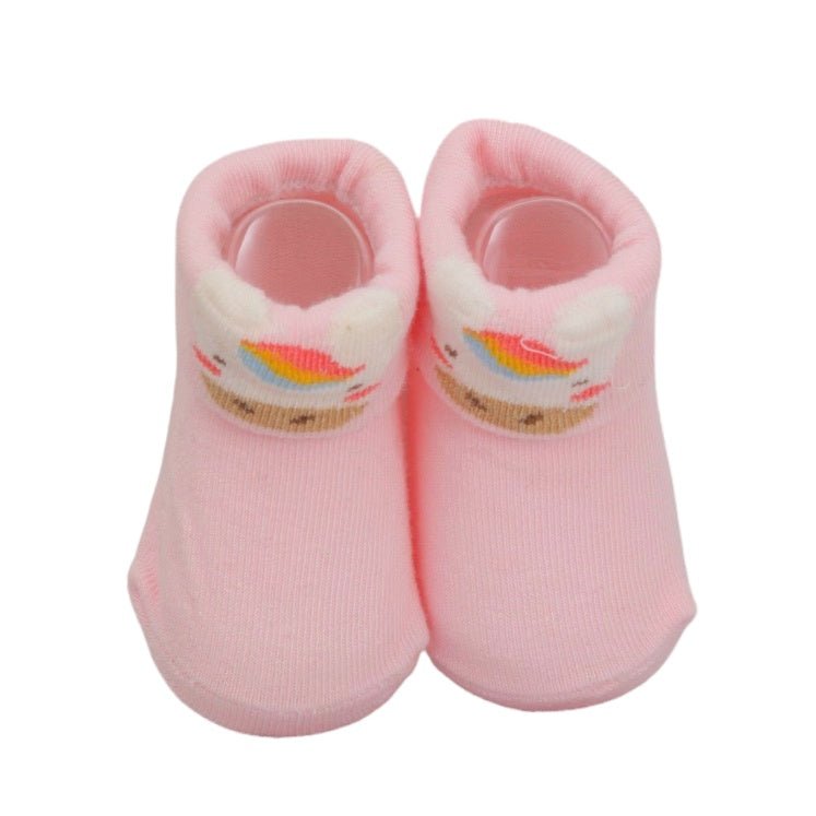 Pair of pink baby socks with unicorn design for girls