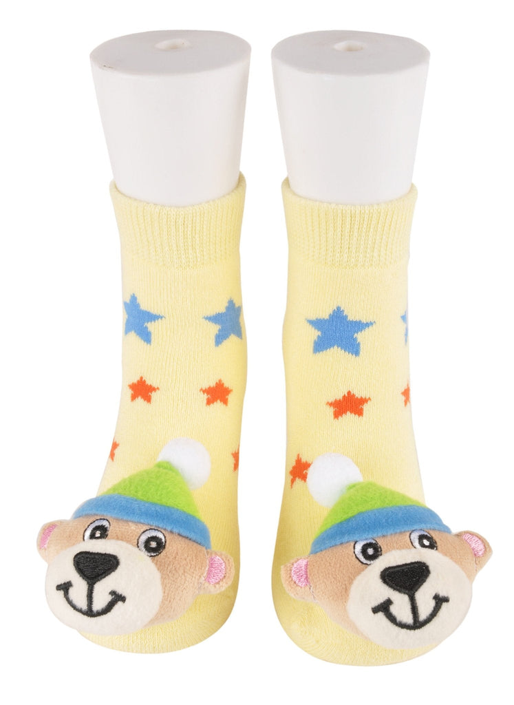 Kids' yellow socks with blue and red stars and plush bear toy detail