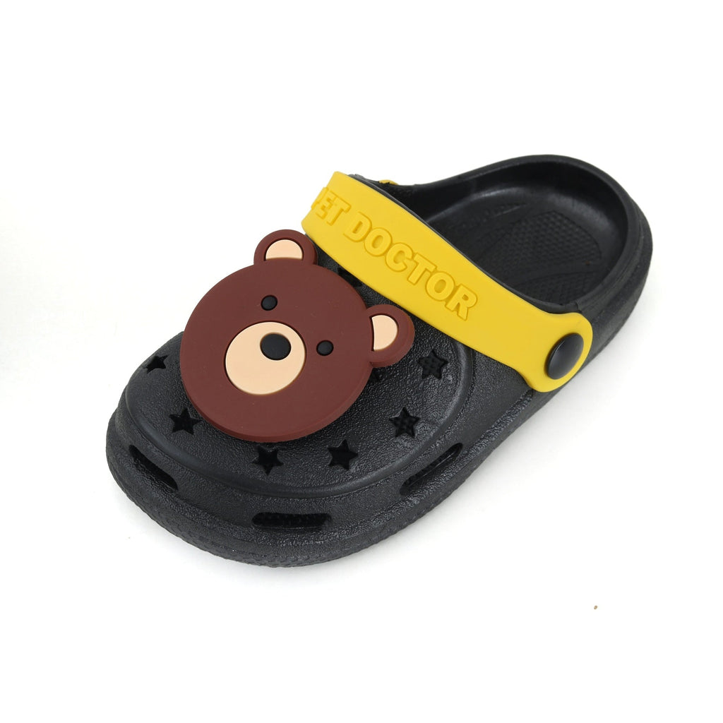 Black clog with bear design and yellow accents, top-down view on a white surface