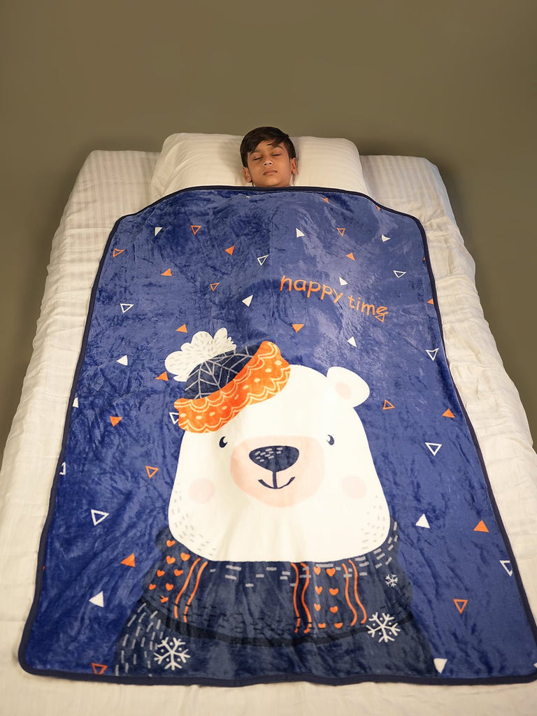 "Sleeping child covered with a soft polar bear blanket, peacefully resting in a bed with star decals on the wall.